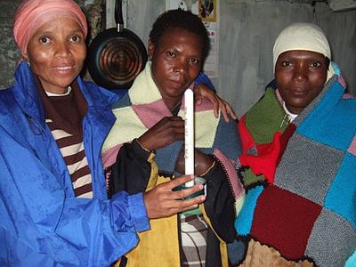 Gladys, Agnes and Puleng (right) with the light of Christ.