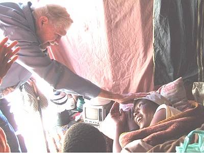 Inside the shack - Blessing Puleng who lies here critically ill - we later transported her back to the Hospice