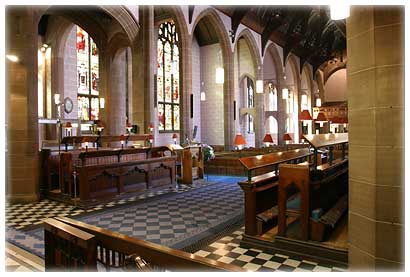 A photo taken inside the church looking across the sanctuary.