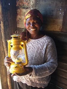 Sara with her new paraffin lamp, now they will have light