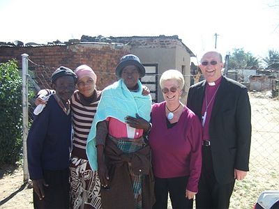 After Bishop Nicholas prayed for and anointed George and Elizabeth, Christine gave Elizabeth a blanket knitted by a lady from Blackburn Diocese.
