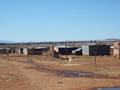 The people live in tin shacks in a 38 degree heat.